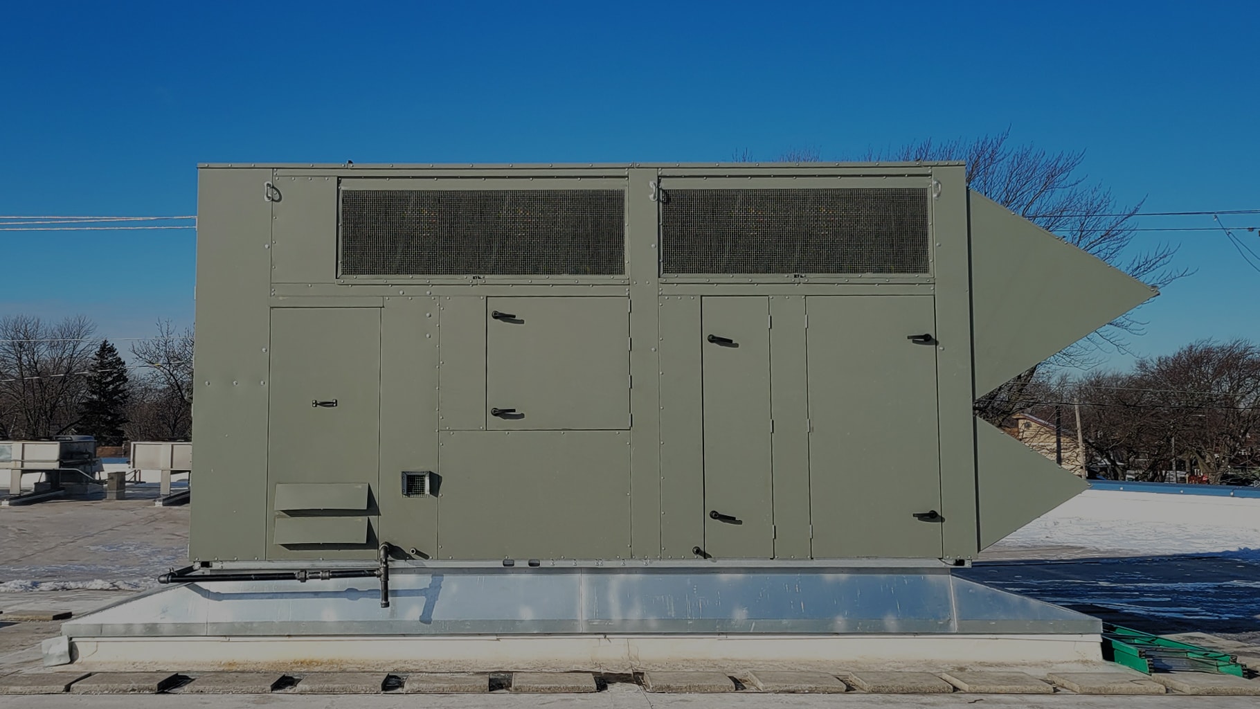 A rooftop HVAC unit being installed by PCS